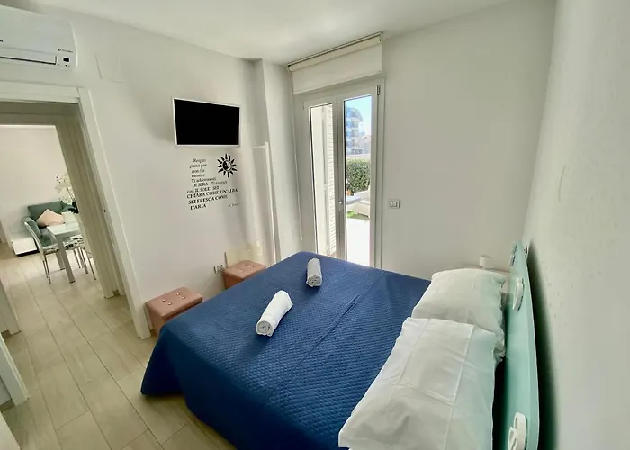 Апартаменты Al Mare Con Giardino, E Piscina